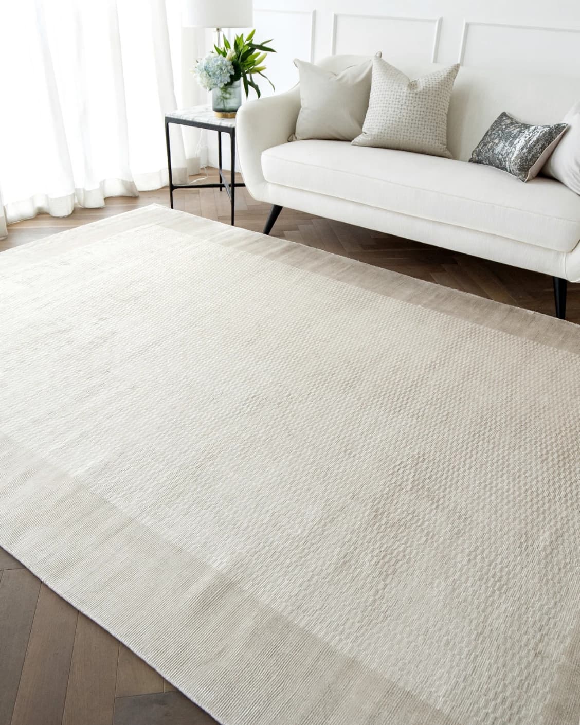 Luna Clay carpet in beige, shown in a lifestyle right view as image 5