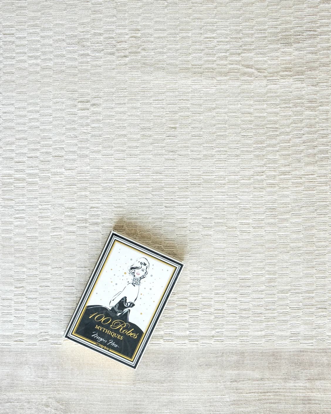 Luna Clay carpet in beige, shown in a lifestyle top view as image 6
