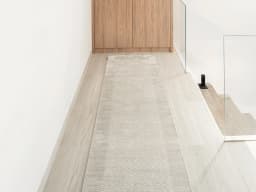 Luna Clay Runners carpet in beige, shown in a lifestyle front view