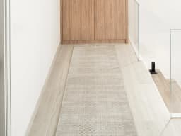 Luna Sandy Runners carpet in beige, shown in a lifestyle front view