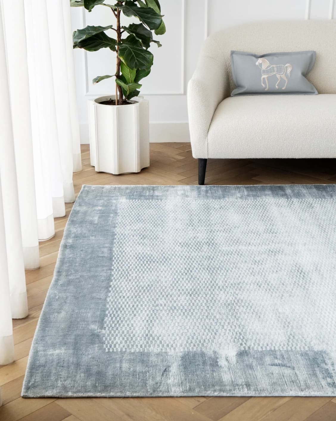 Luna Sky carpets in blue, shown in a lifestyle front view as image 2