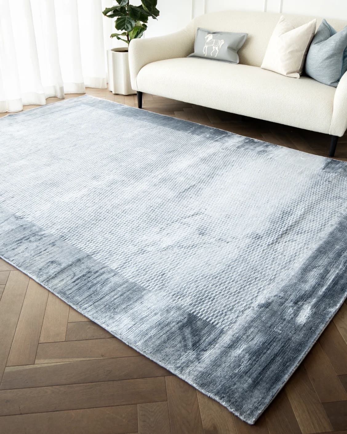 Luna Sky carpets in blue, shown in a lifestyle right view as image 3