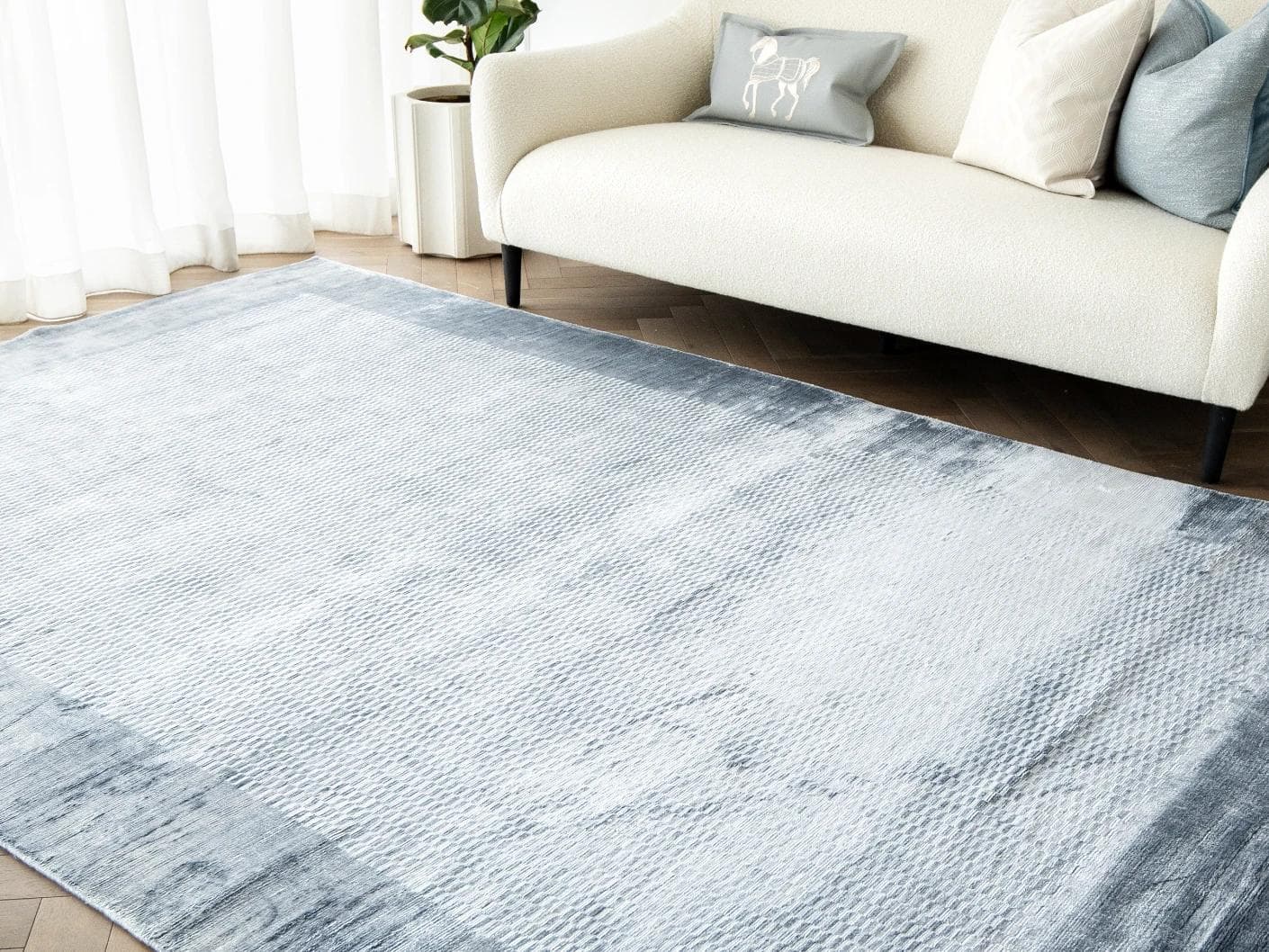 Luna Sky carpets in blue, shown in a lifestyle right view as image 3