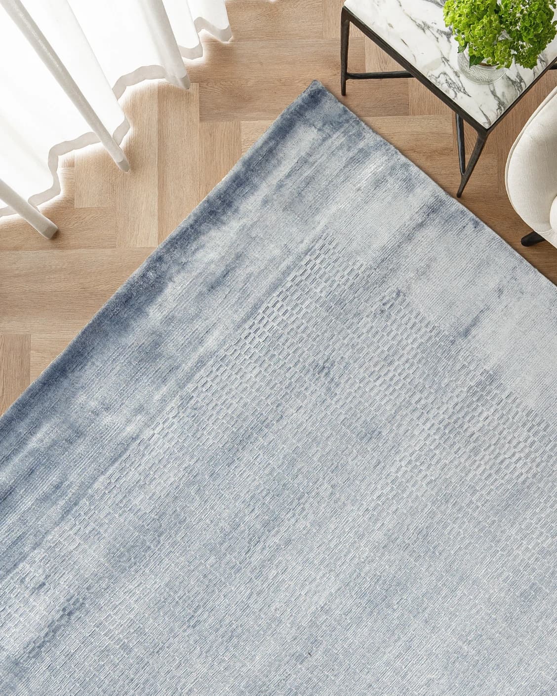 Luna Sky carpet in sky and blue, shown in a lifestyle top view as image 2