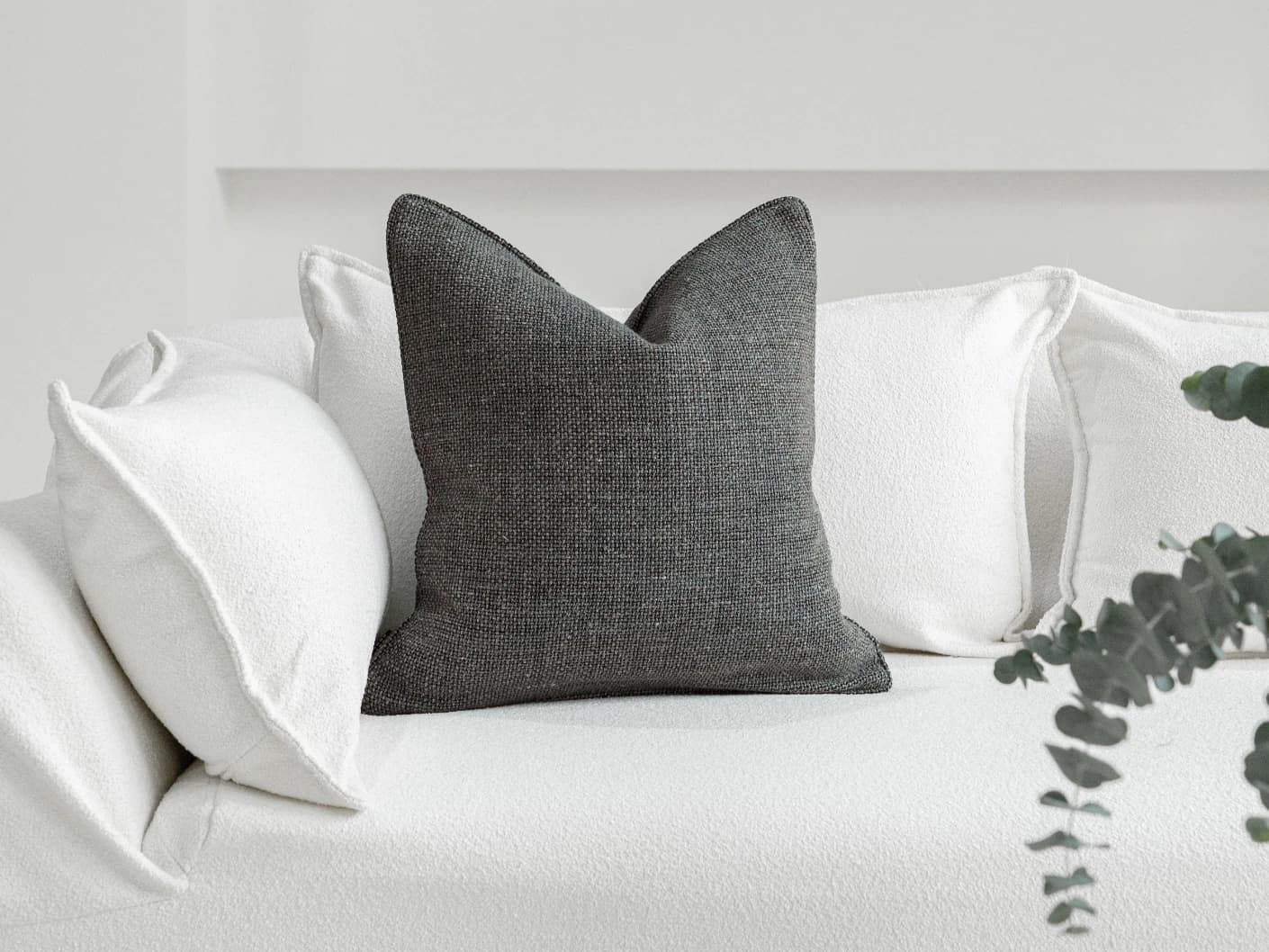 Lynn Canova single cushions in blue, shown in a lifestyle front view