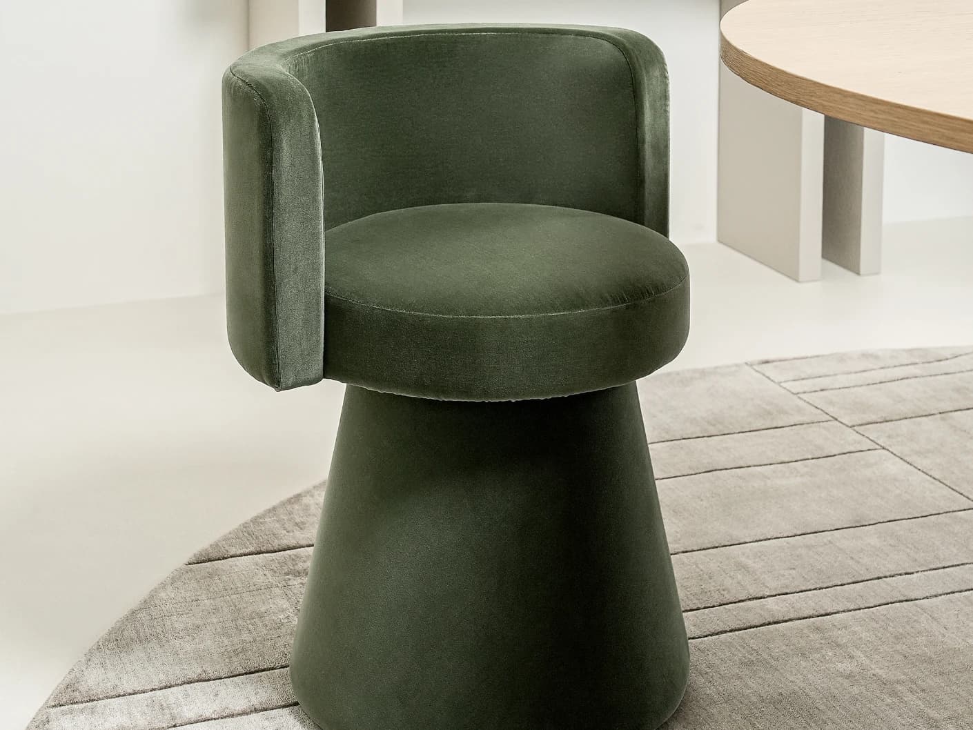 Mara Forest swivel chair in forest green, shown in a lifestyle left view as image 3