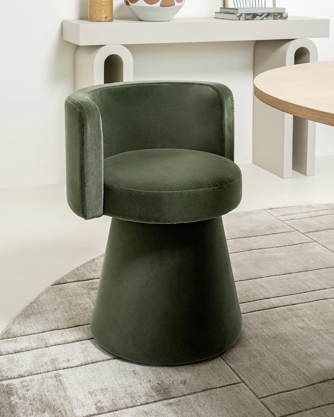 Mara Forest swivel chair in forest green, shown in a lifestyle left view as image 2