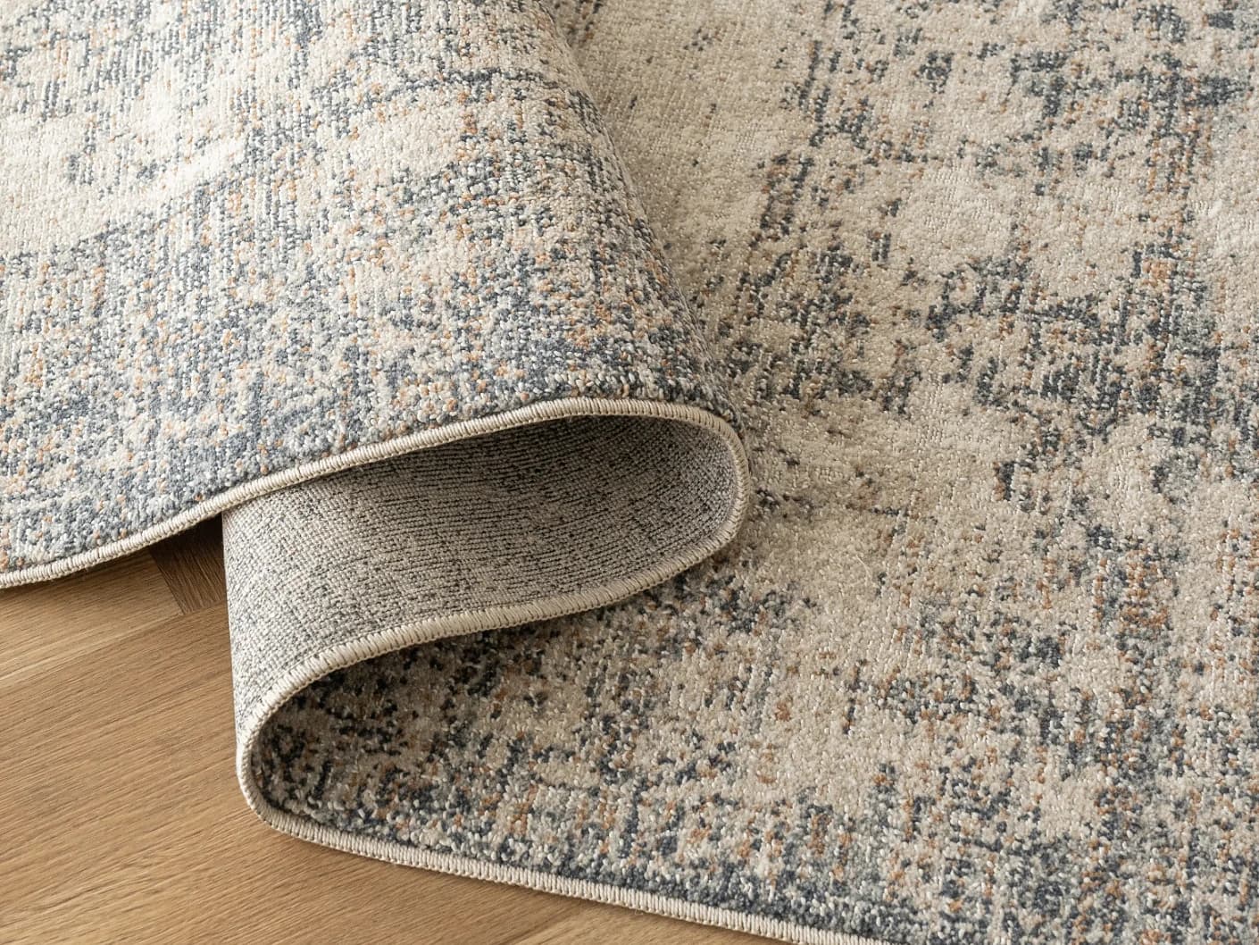 Marco Azure carpets in azure, cream, grey and beige, shown in a product close-up view