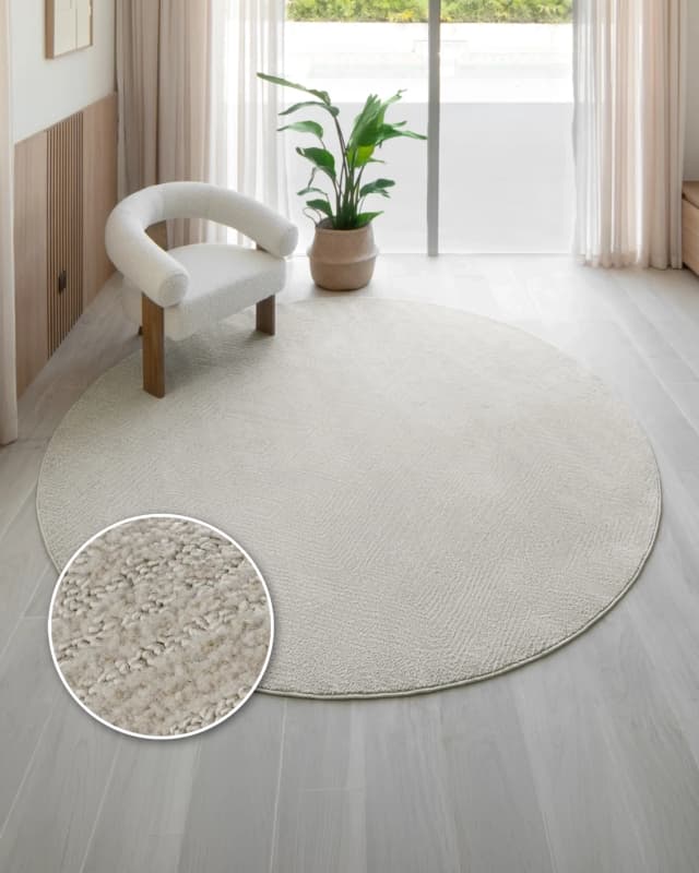 Marco Sandy Round carpet in beige, shown in a lifestyle front view