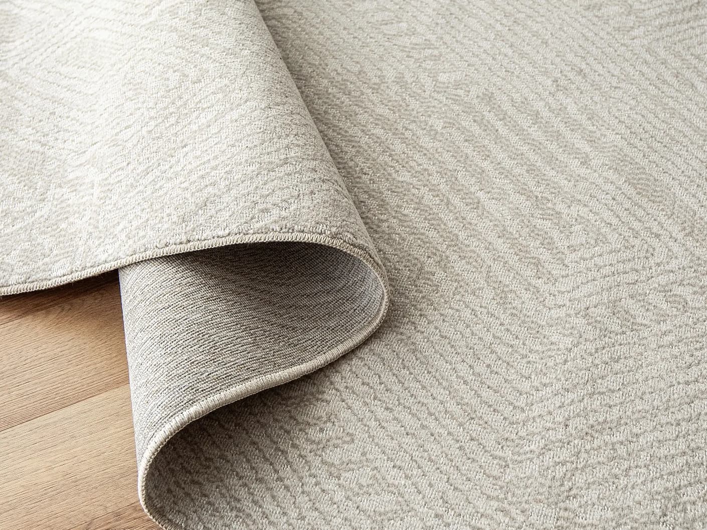 Marco Sandy Round carpets in sandy and beige, shown in a product close-up view