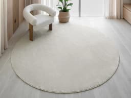 Marco Sandy Round carpet in beige, shown in a lifestyle front view