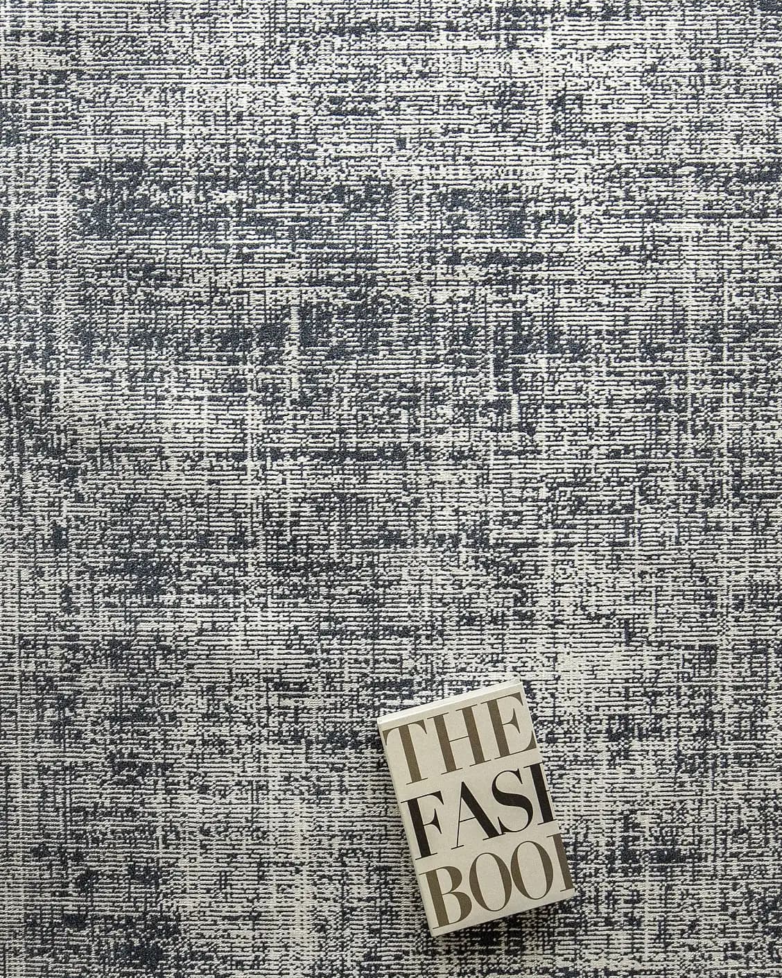 Marco Sky carpet in sky and blue, shown in a lifestyle top view as image 9