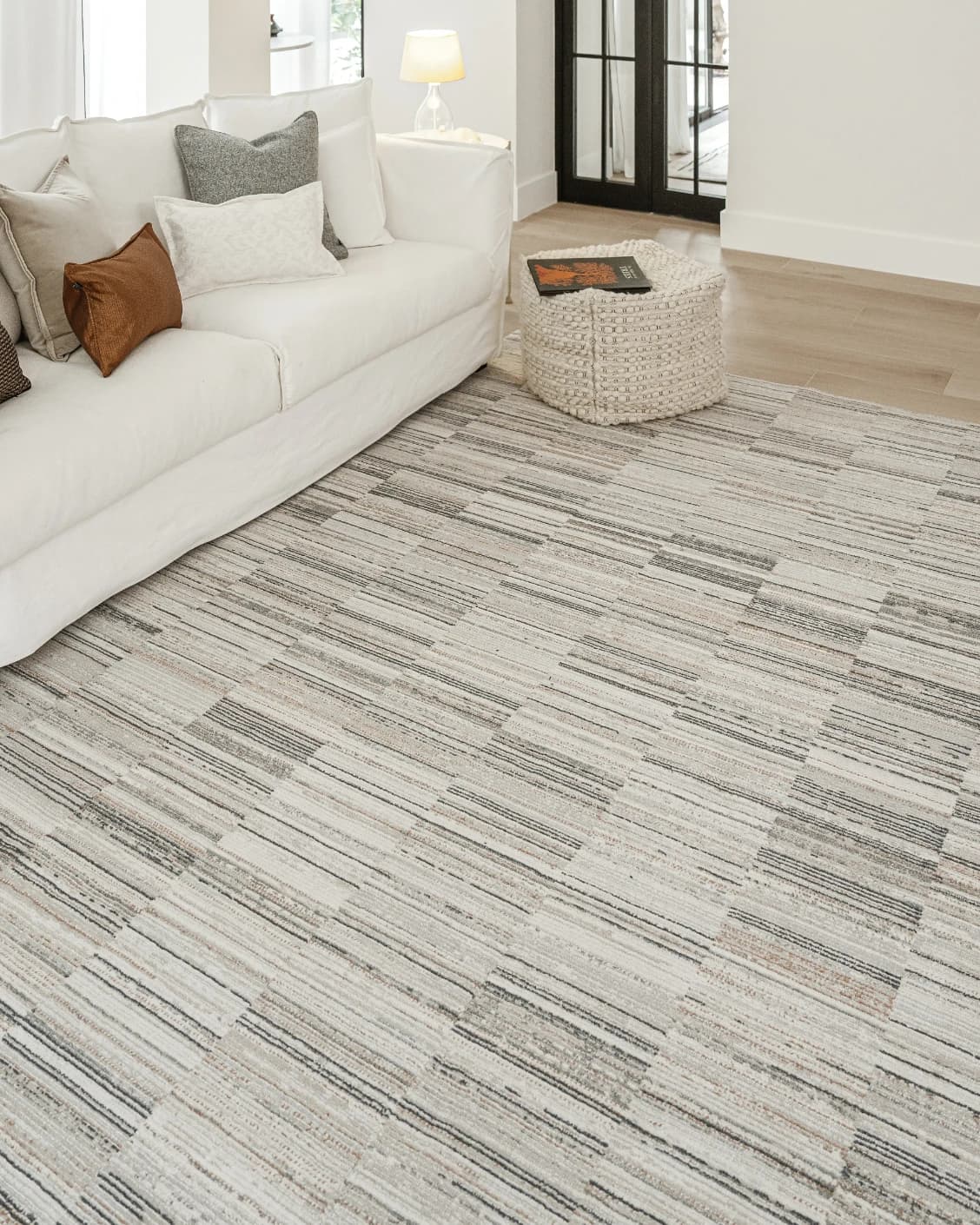 Marco Stone carpet in beige and grey, shown in a lifestyle left view as image 7