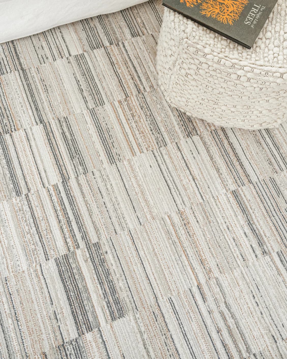 Marco Stone carpet in beige and grey, shown in a lifestyle top view as image 8