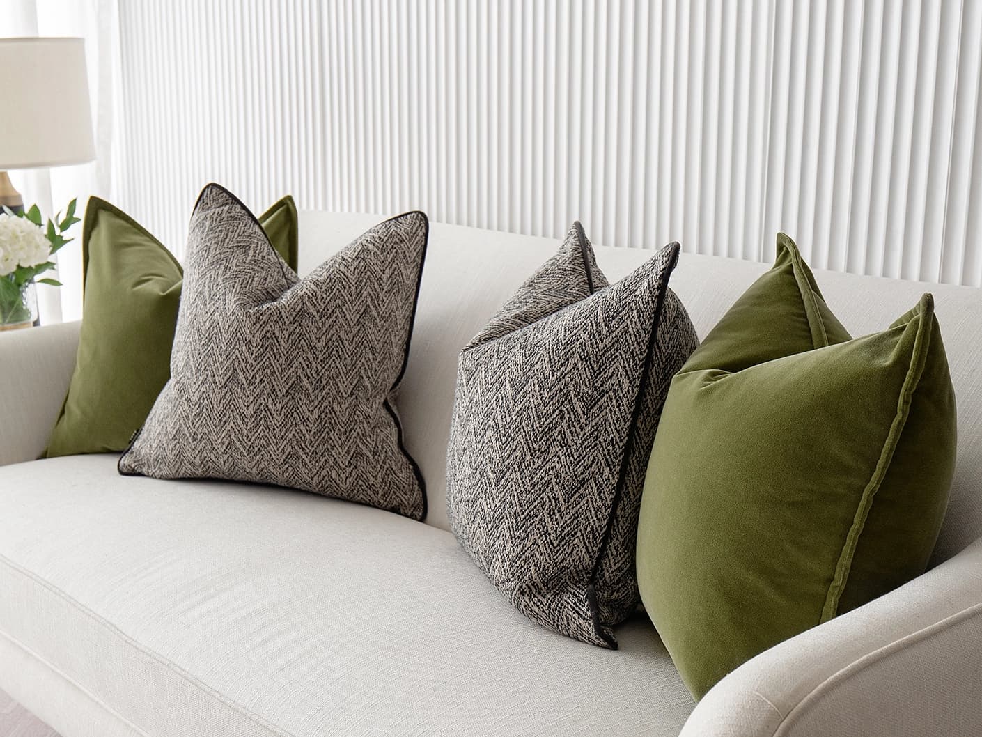 Maribel Bundle bundle cushions in black, white and green, shown in a lifestyle front view