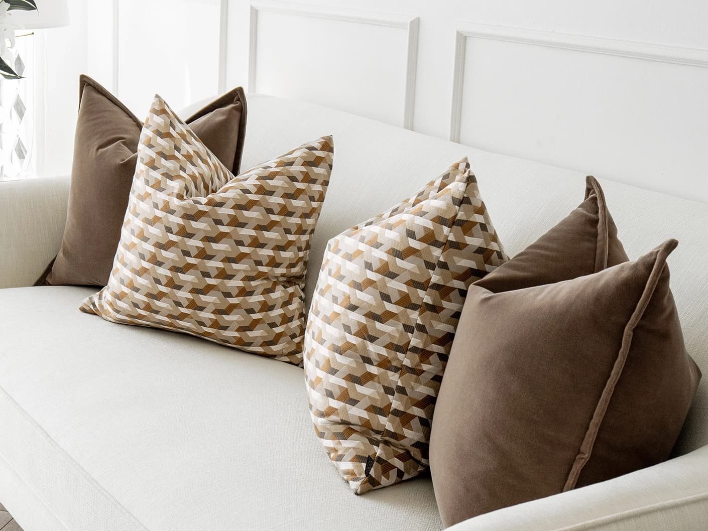 Marilyn Bundle bundle cushions in brown, orange and beige, shown in a lifestyle front view