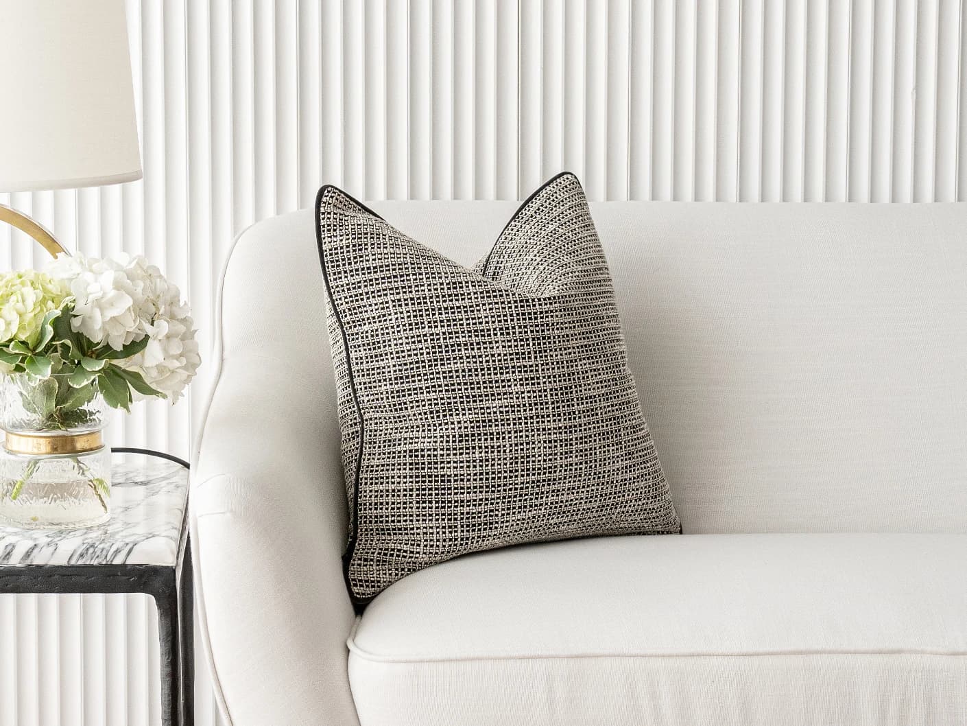Marlee Steele single cushions in black, shown in a lifestyle front view