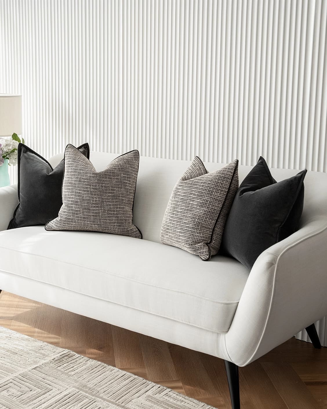 Martina Bundle cushion in grey and black, shown in a lifestyle right view as image 2