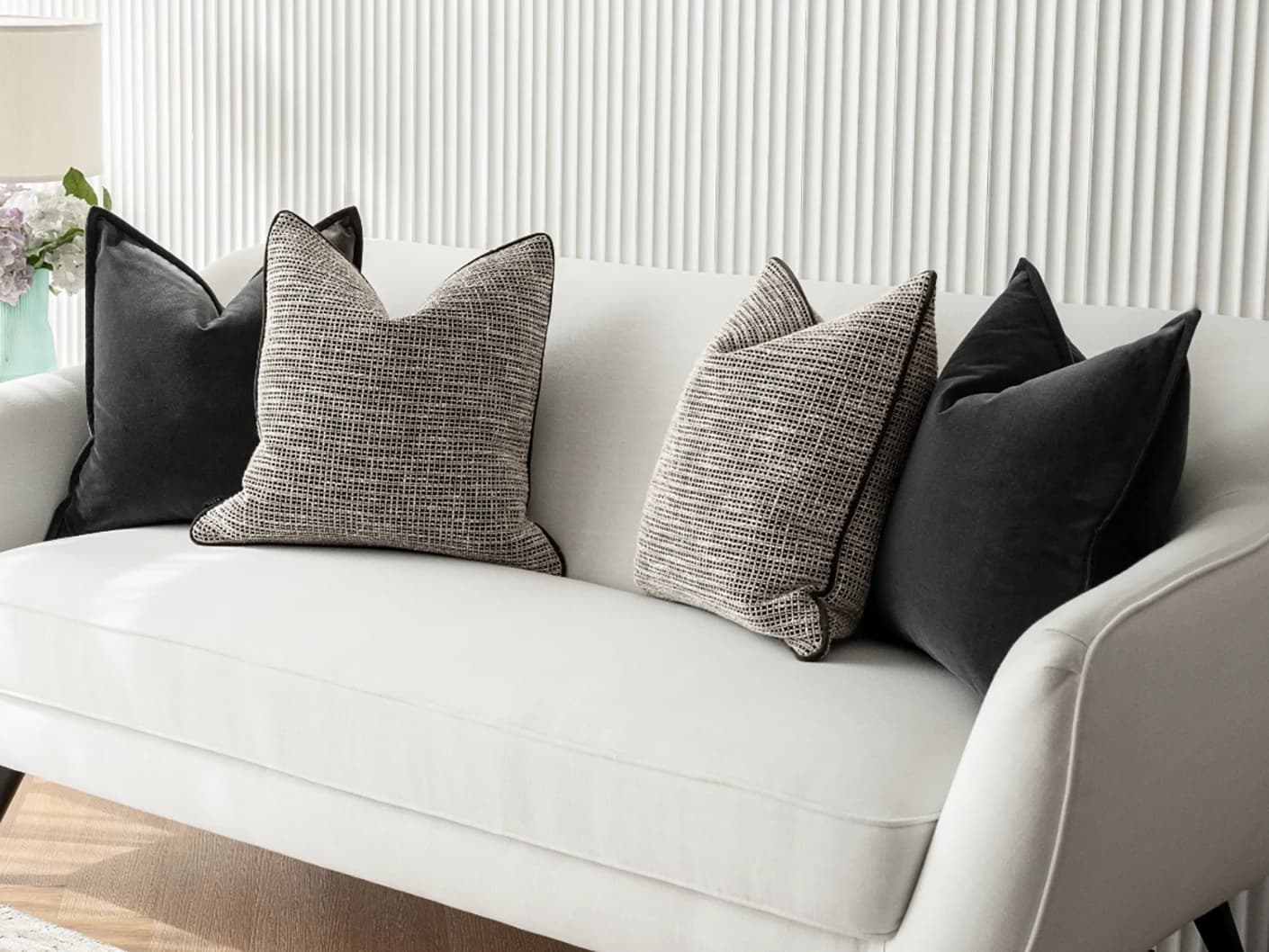 Martina Bundle bundle cushions in grey and black, shown in a lifestyle front view
