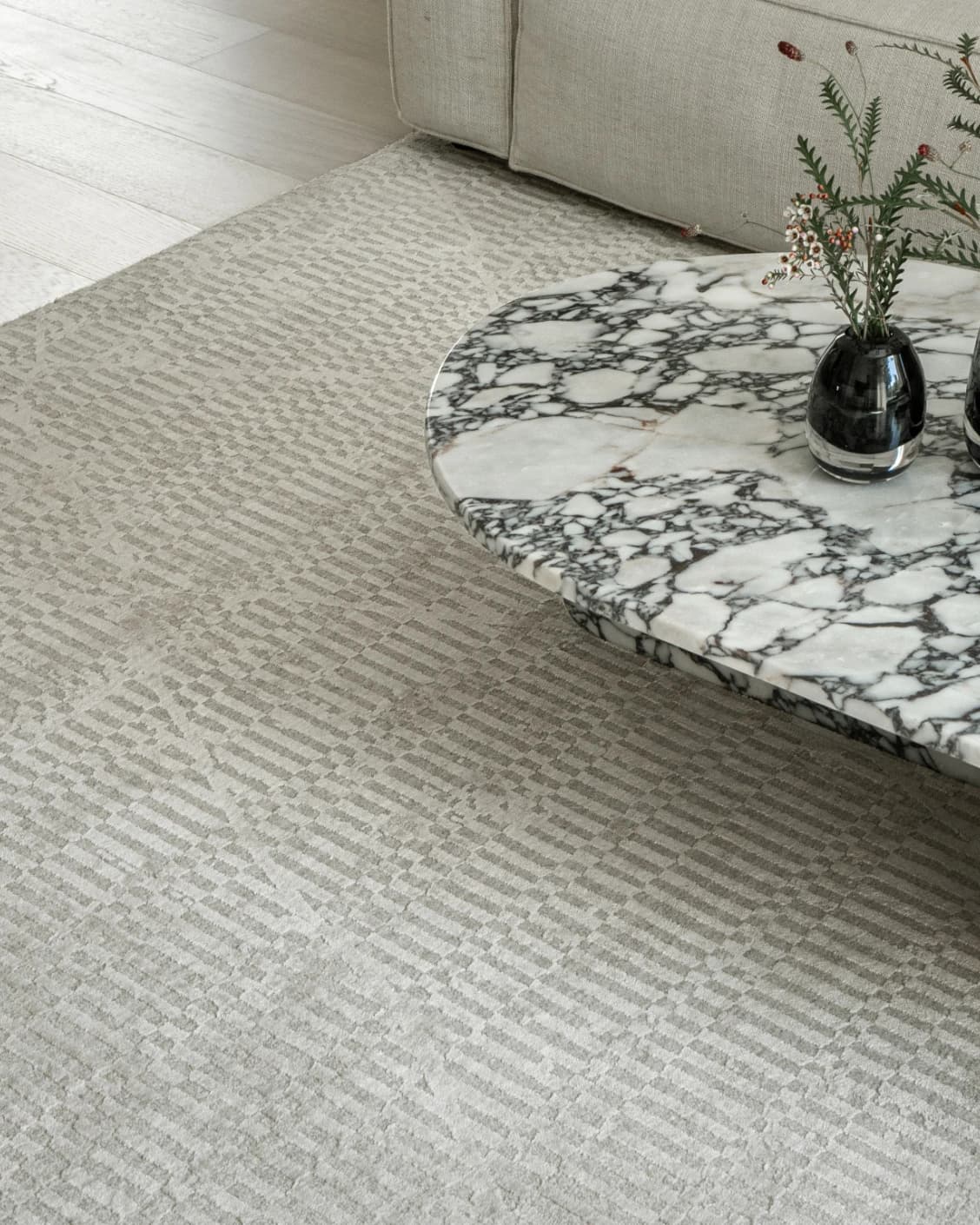 Maverick Sandy carpet in beige, shown in a lifestyle top view as image 6