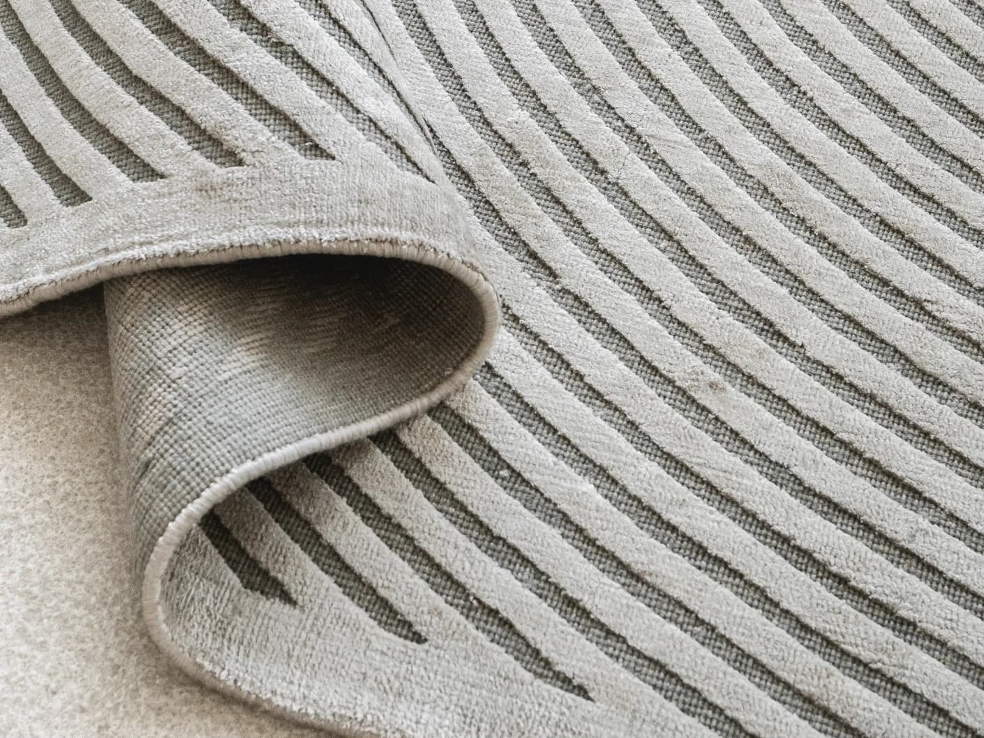 Maze Ashton Round carpets in grey, shown in a product close-up view
