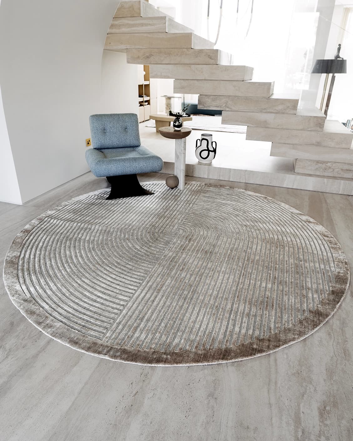 Maze Ashton Round carpet in grey, shown in a lifestyle front view as image 2