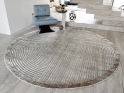 Maze Ashton Round carpet in grey, shown in a lifestyle front view