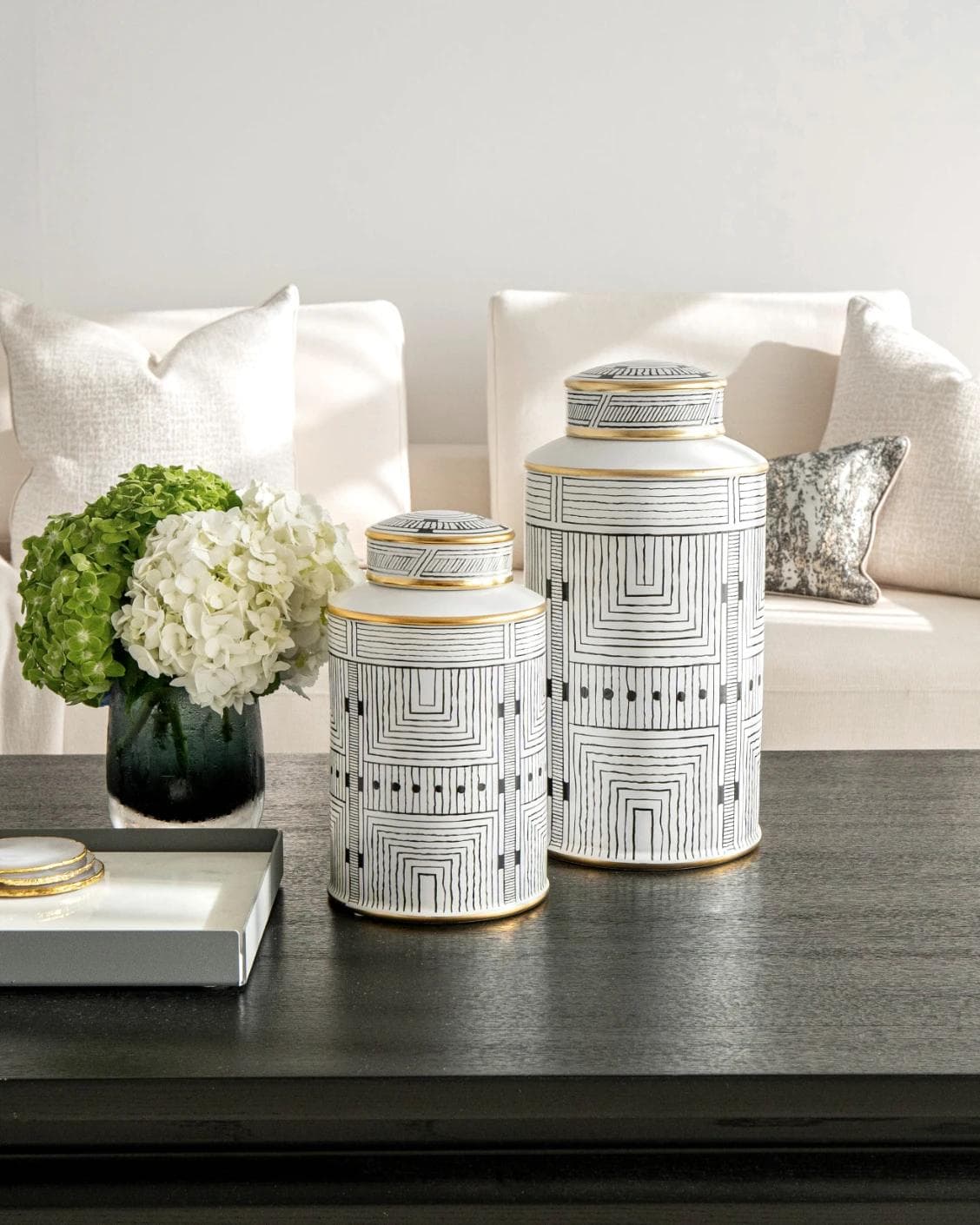 Maze Arneson canisters in black and white, shown in a lifestyle front view as image 11