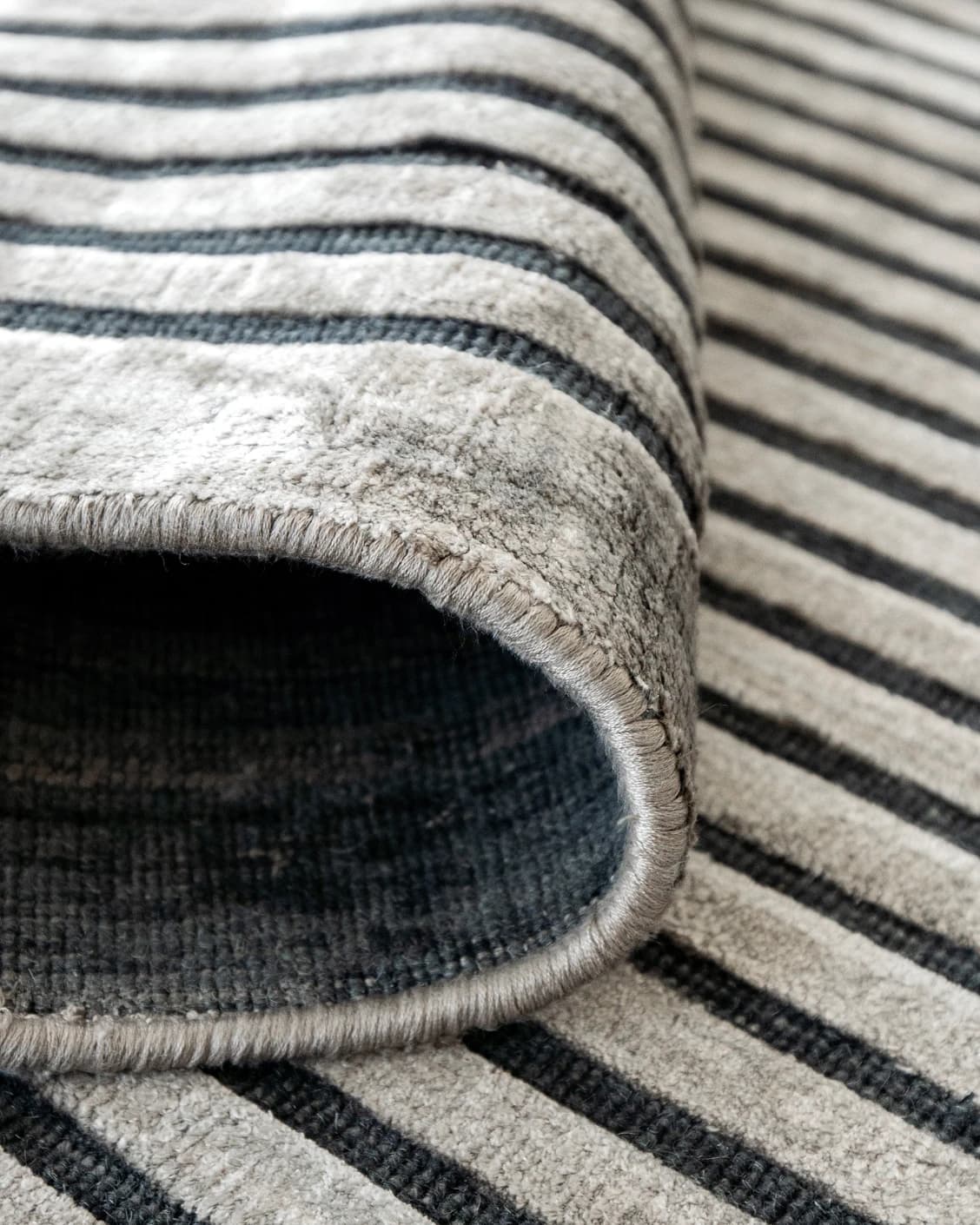 Maze Ebony carpet in grey and charcoal, shown in a product close-up as image 8
