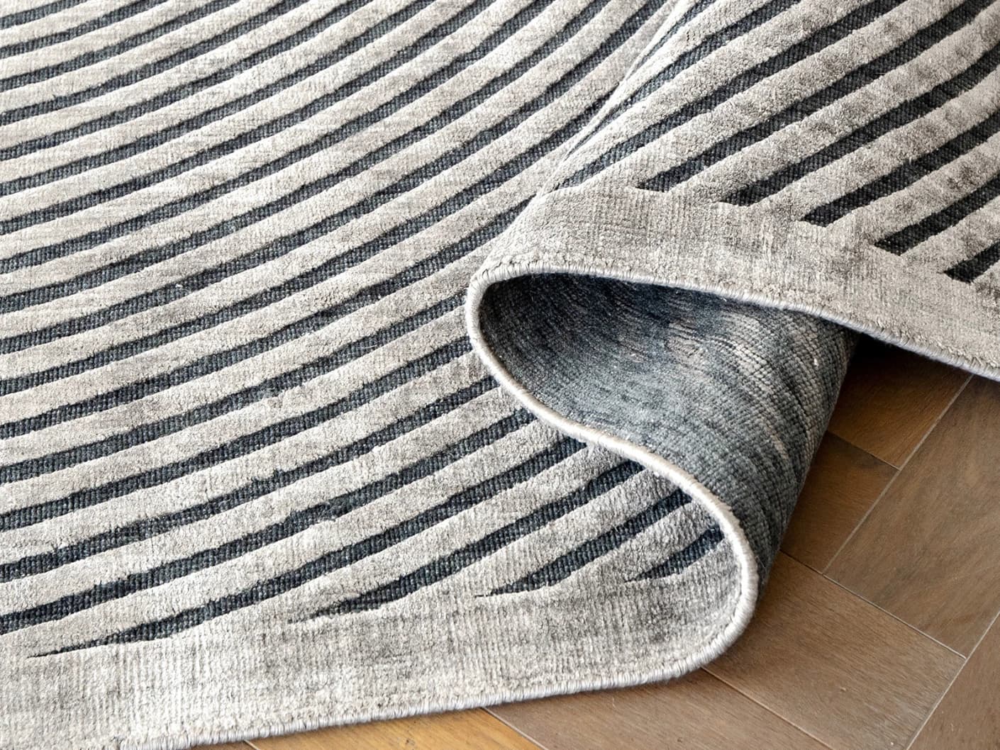 Maze Ebony carpets in ebony, grey and charcoal, shown in a product close-up view