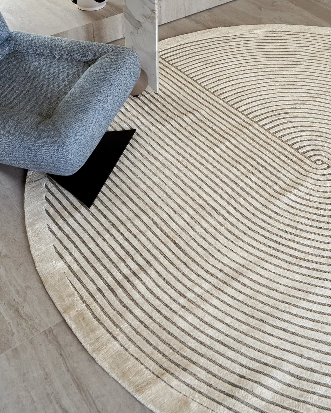 Maze Sandy Round carpet in sandy and beige, shown in a lifestyle close-up top view as image 4