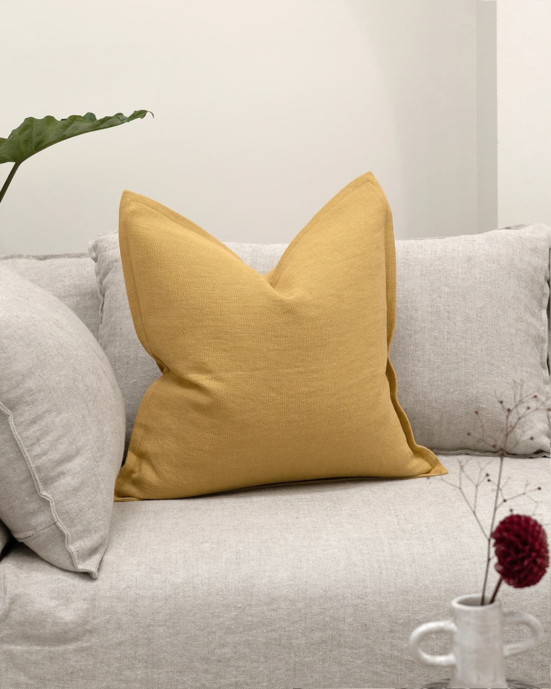 Mel Barrymore cushion in yellow, shown in a lifestyle front view as image 2