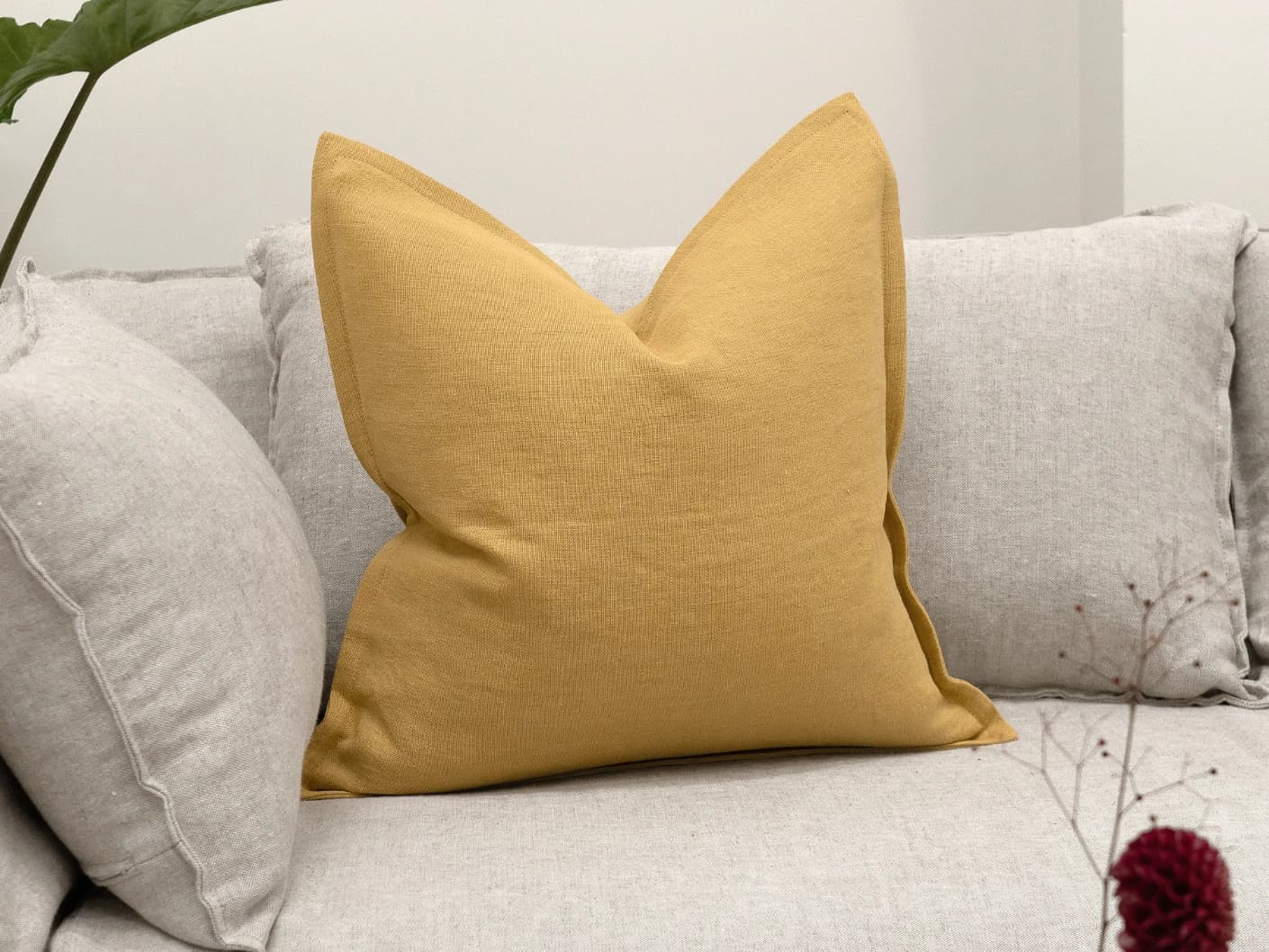 Mel Barrymore single cushions in yellow, shown in a lifestyle front view