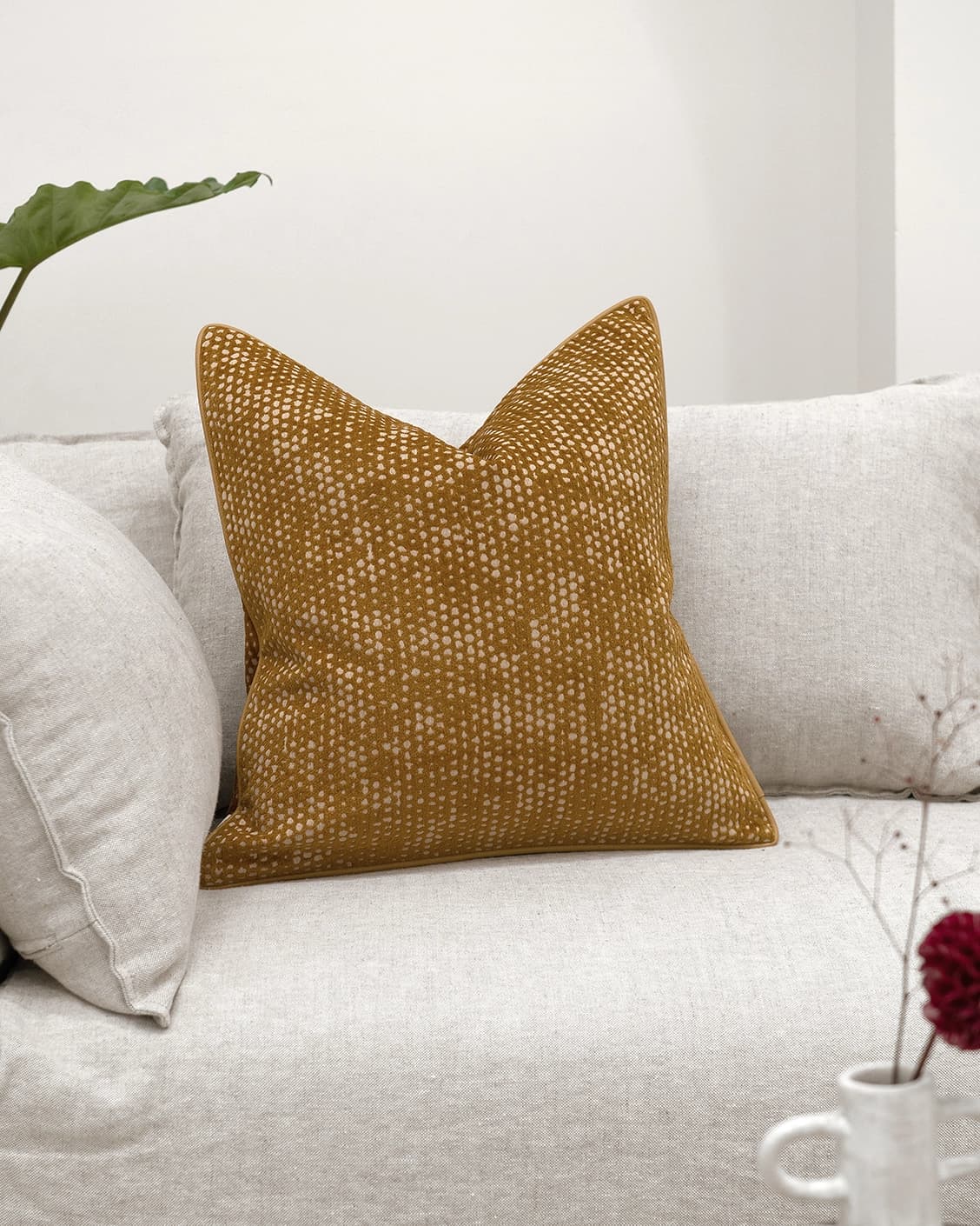 Mercy Barrymore cushion in yellow, shown in a lifestyle front view as image 2