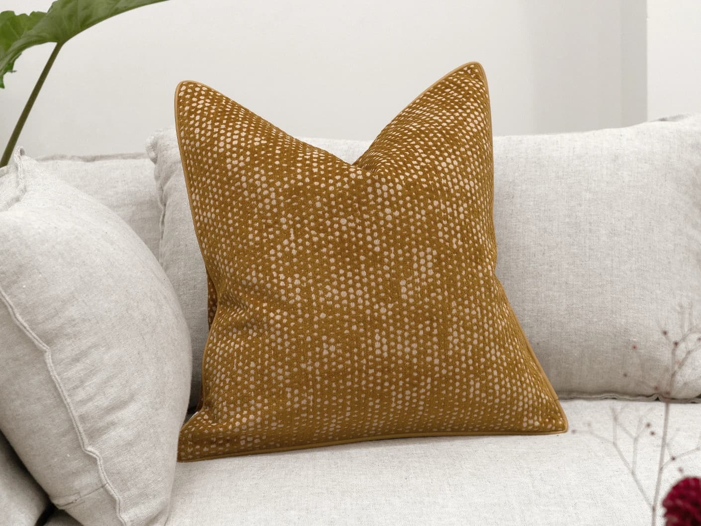 Mercy Barrymore single cushions in yellow, shown in a lifestyle front view