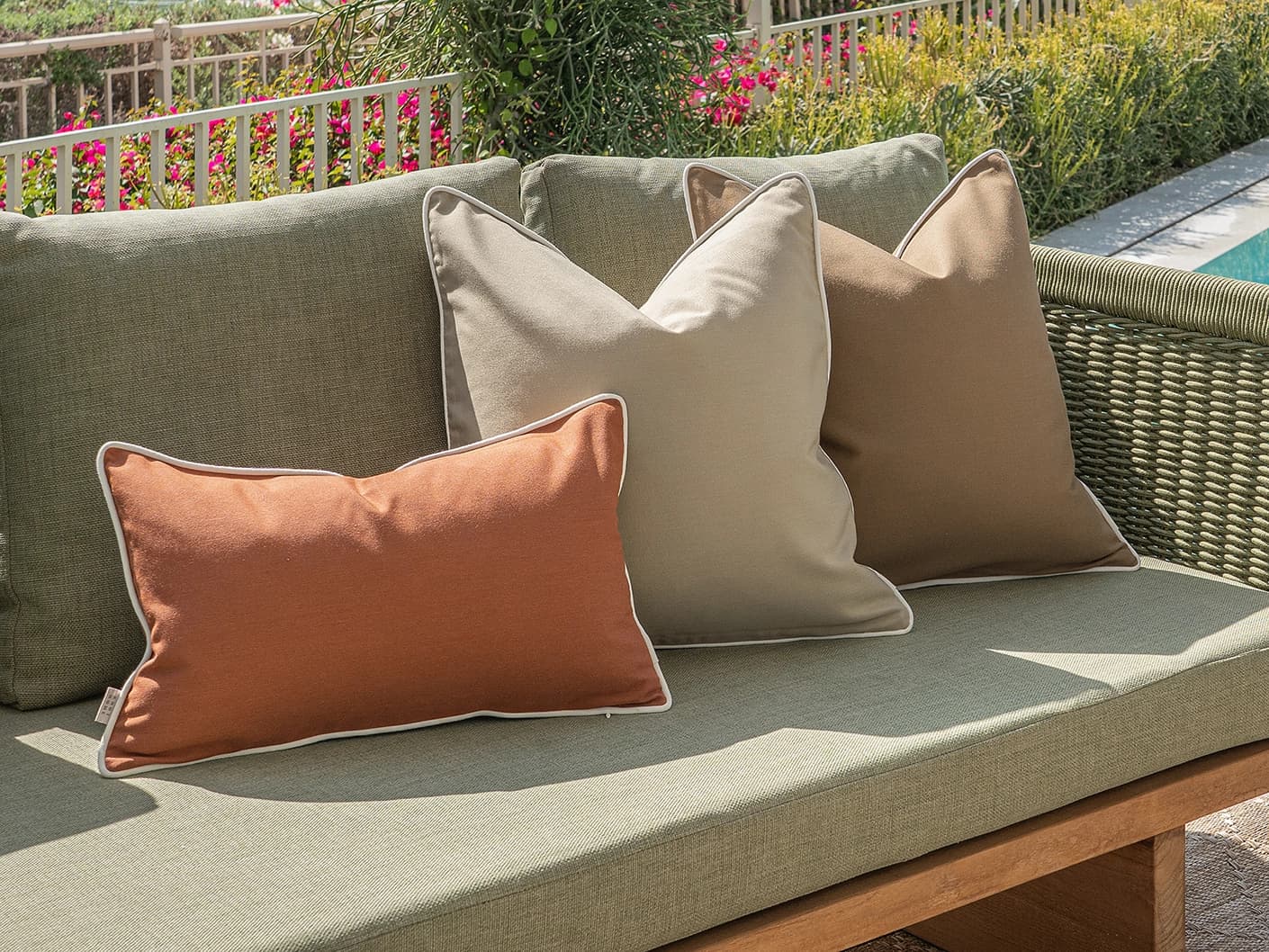 Meryl Bundle bundle cushions in brown and rust, shown in a lifestyle front view