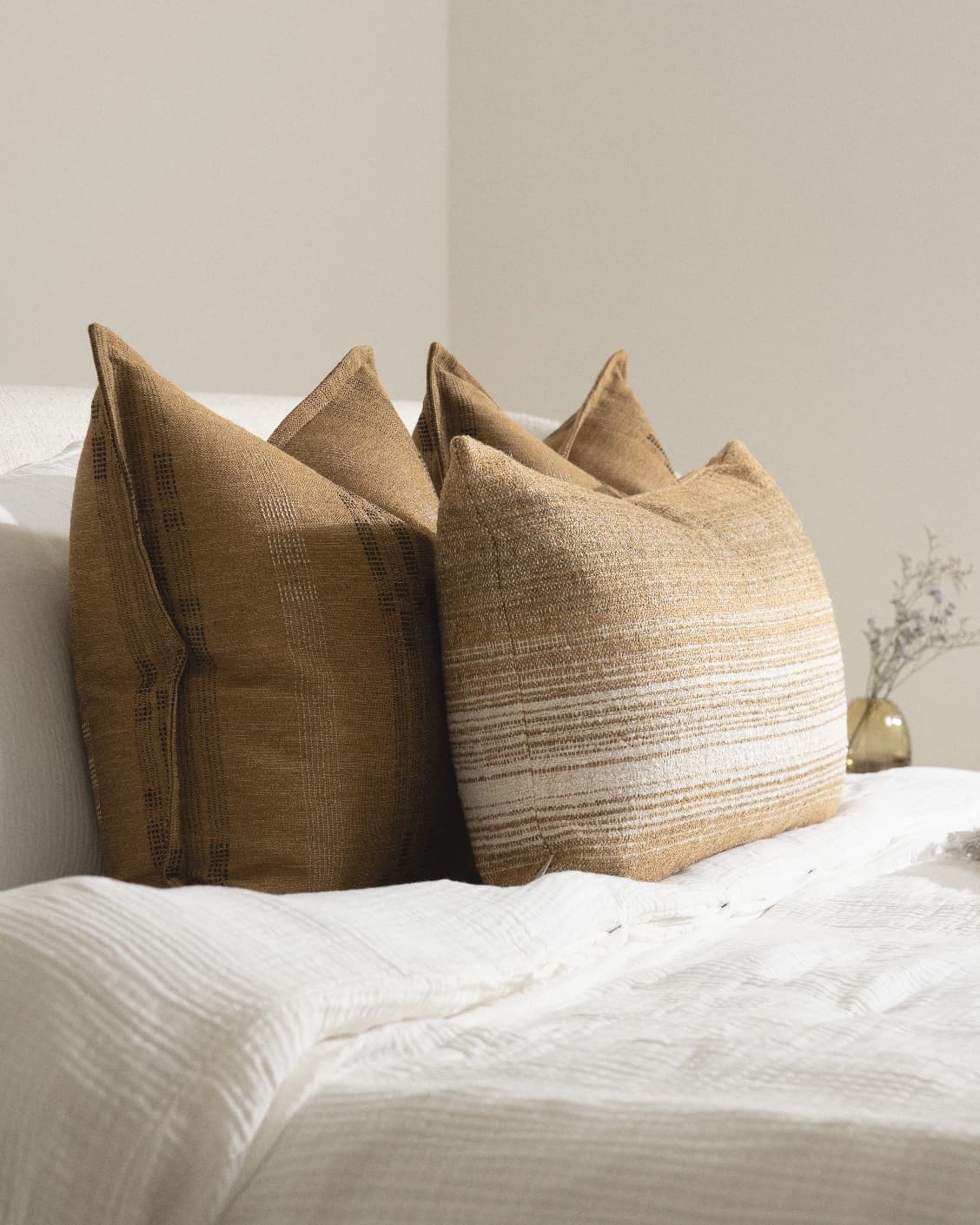 Mihi Bundle cushion in ochre and cream, shown in a lifestyle left view as image 7