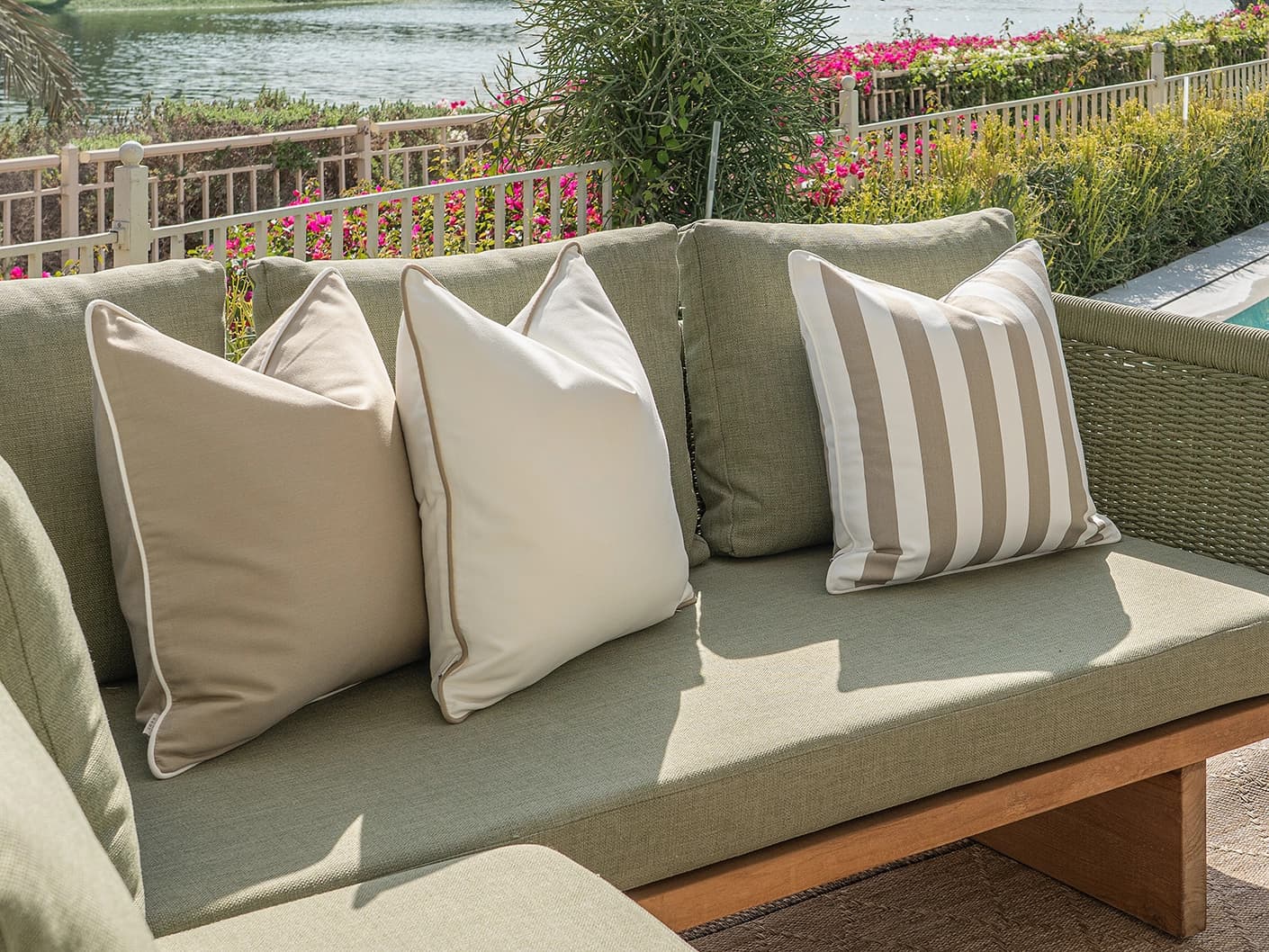 Miko Bundle bundle cushions in brown, ivory and beige, shown in a lifestyle front view