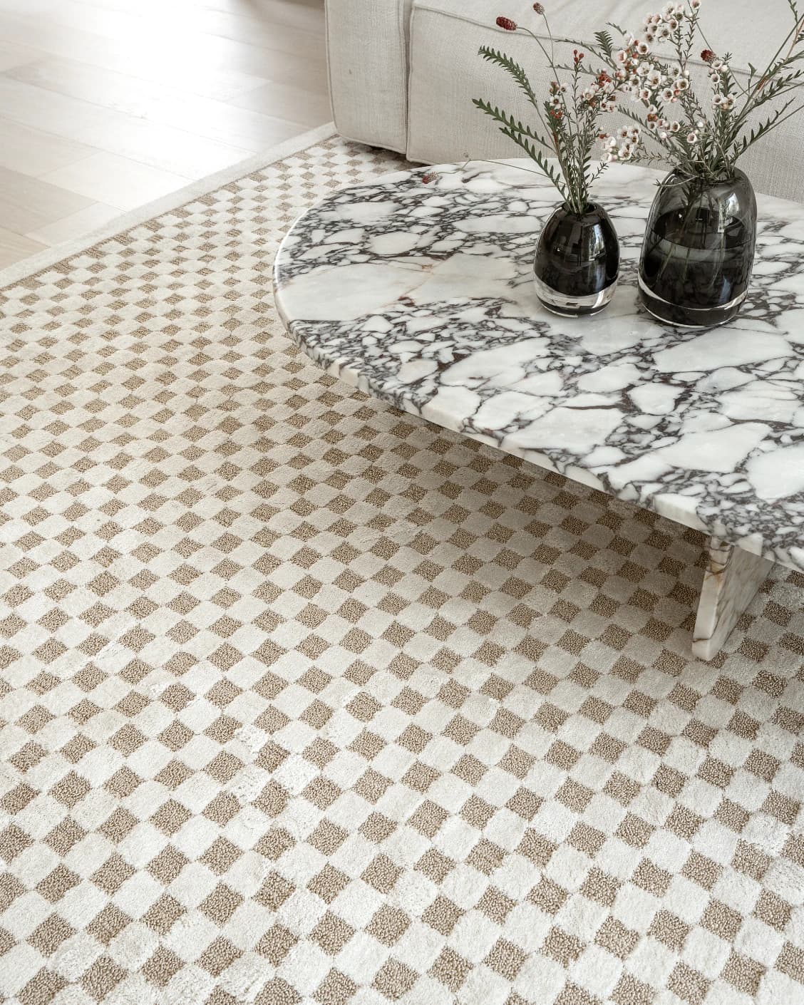 Milo Sandy Round carpet in sandy and beige, shown in a lifestyle close-up top view as image 4