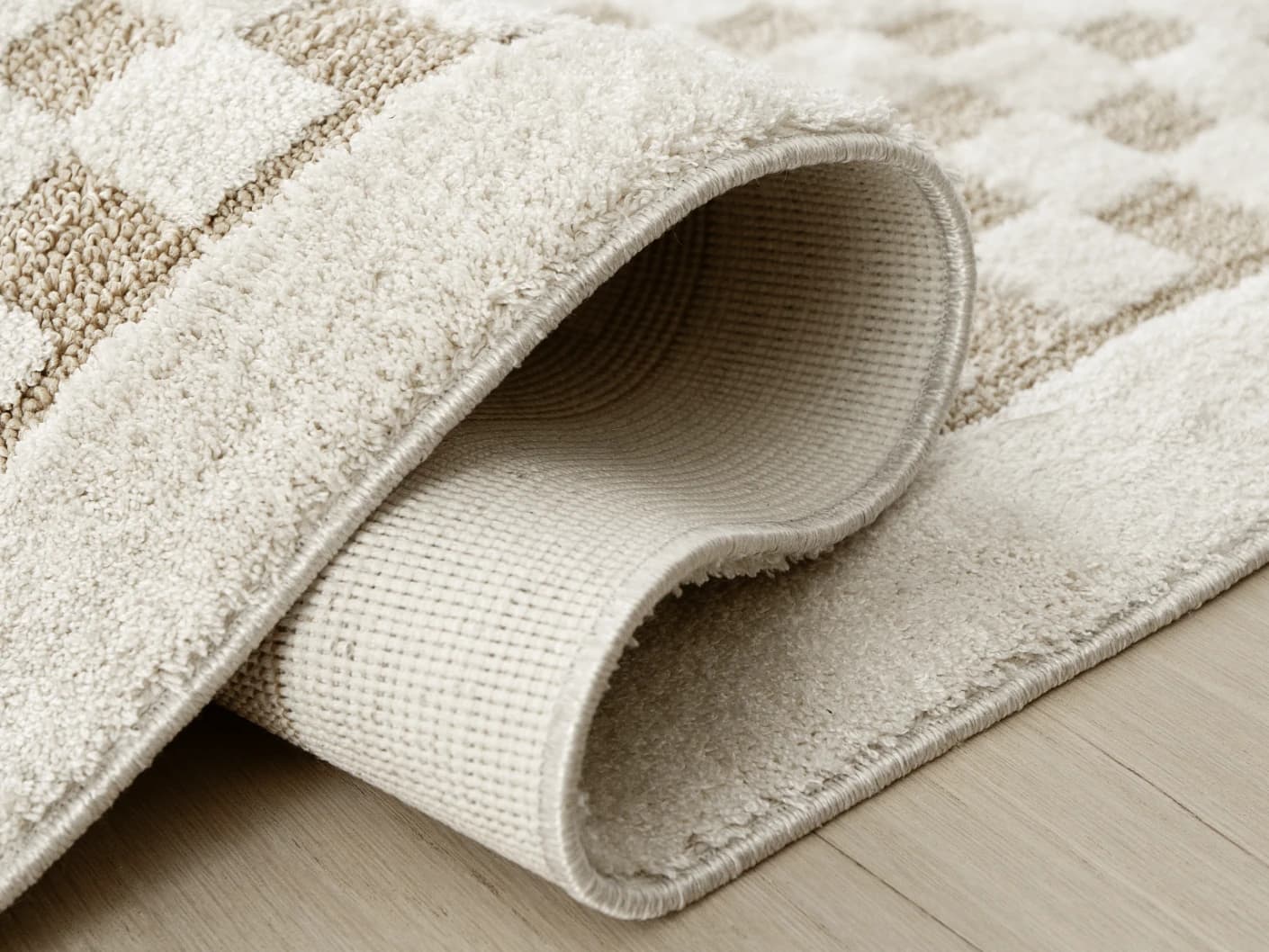Milo Sandy carpets in sandy and beige, shown in a product close-up view