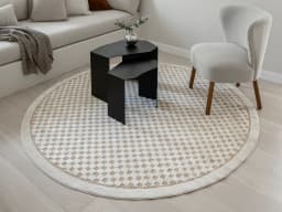 Milo Sandy Round carpet in sandy and beige, shown in a lifestyle front view