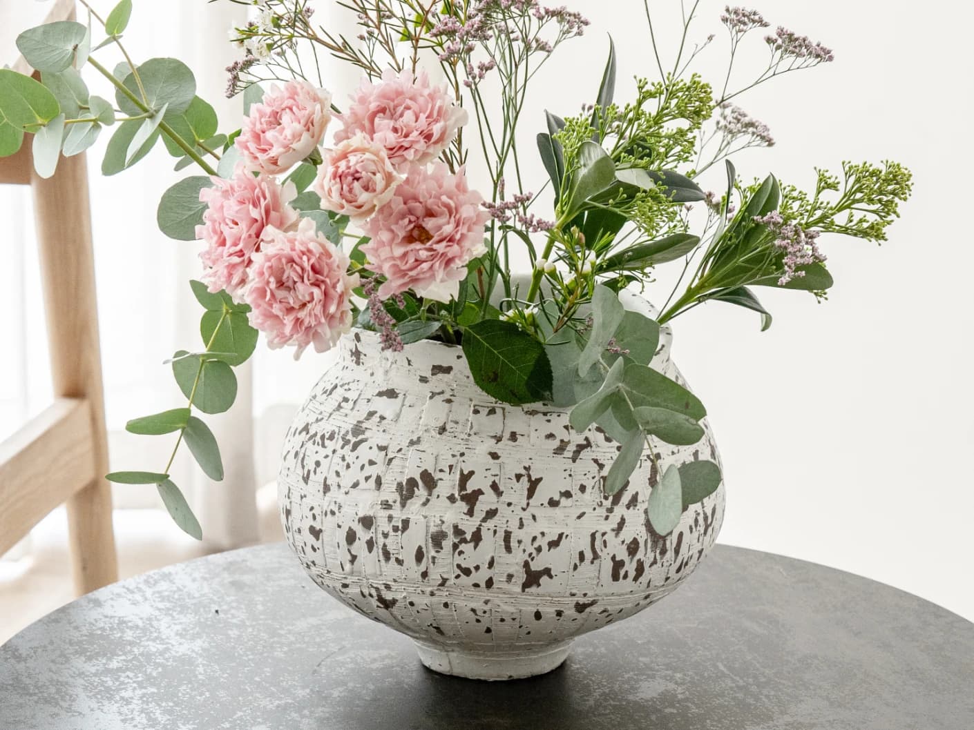 Miraflora Arneson vases in white and grey, shown in a lifestyle front view