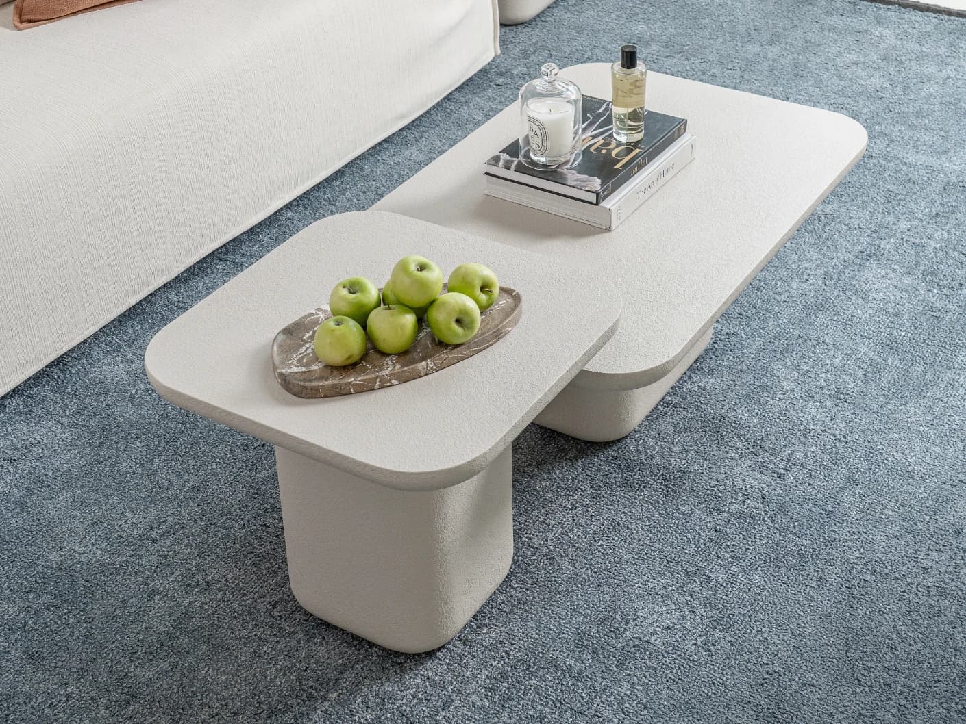 Modena Set Of 2 coffee table in soft ivory and stone, shown in a lifestyle top view