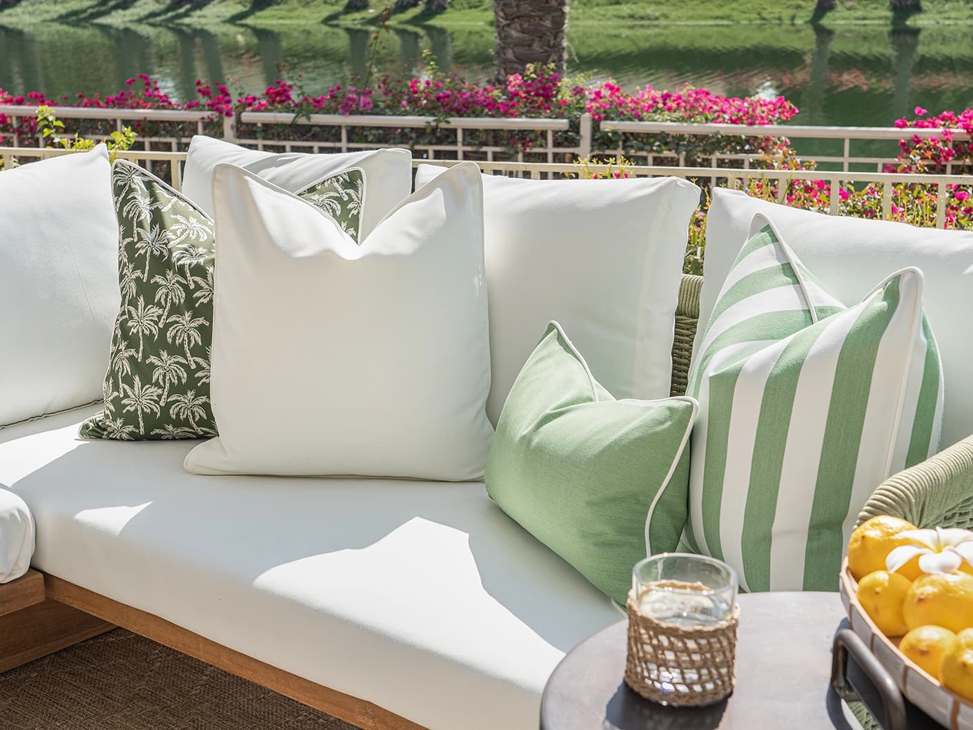 Mysha Bundle bundle cushions in ivory and green, shown in a lifestyle front view