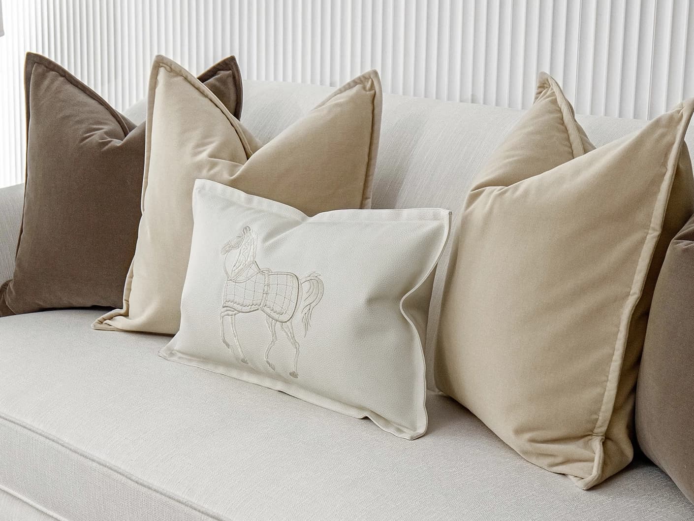 Nadine Bundle bundle cushions in beige, brown and white, shown in a lifestyle front view