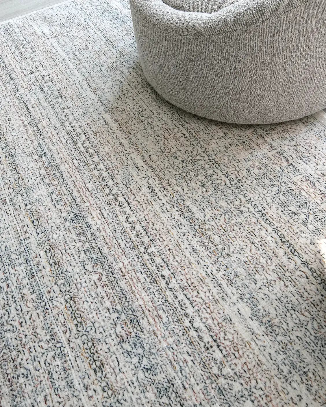 Natalia Azure carpet in blue and grey, shown in a lifestyle close-up as image 4