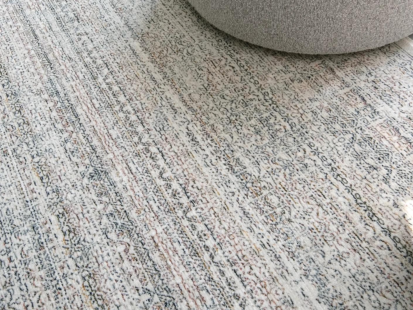 Natalia Azure carpet in blue and grey, shown in a lifestyle close-up as image 4