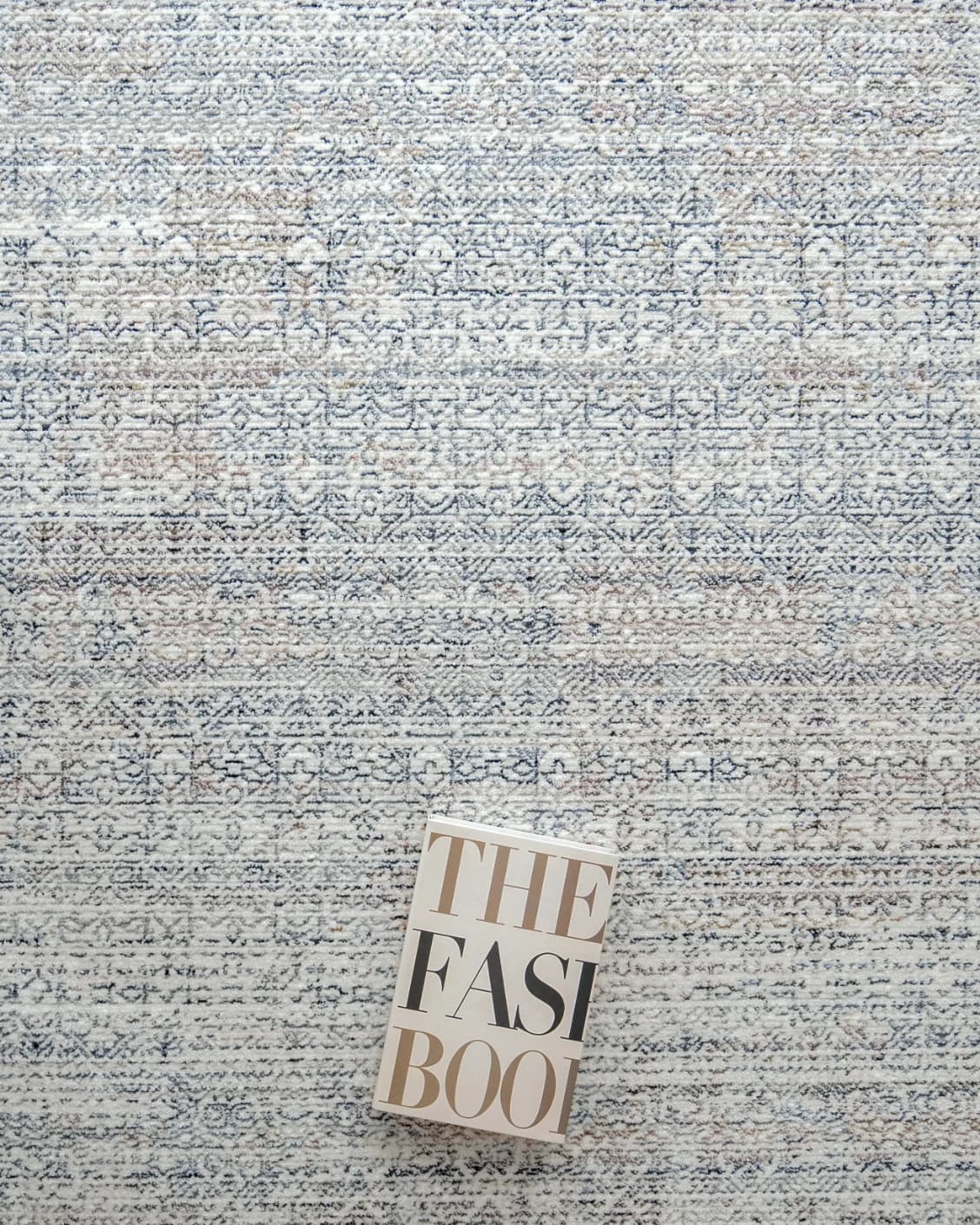 Natalia Azure carpet in blue and grey, shown in a lifestyle top view as image 8