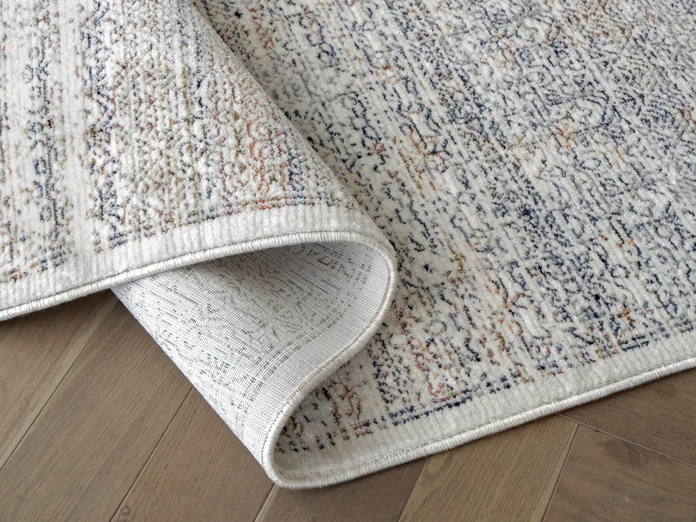 Natalia Azure carpets in azure, blue and grey, shown in a product close-up view