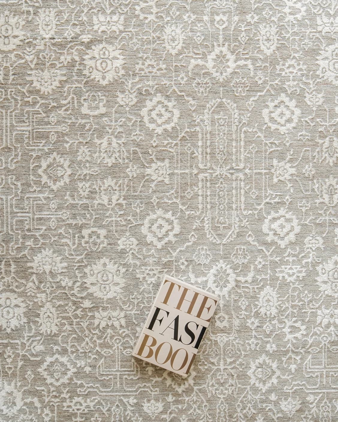 Natalia Sandy carpet in beige and grey, shown in a lifestyle top view as image 7